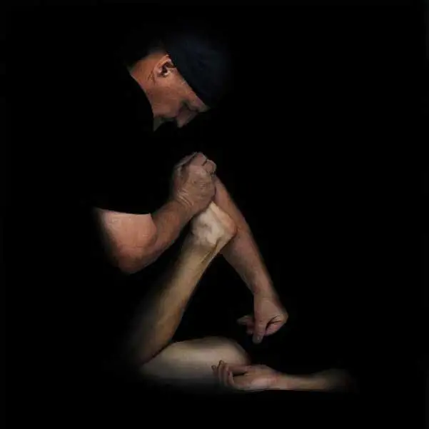 Massage therapist performing a leg mobilization technique